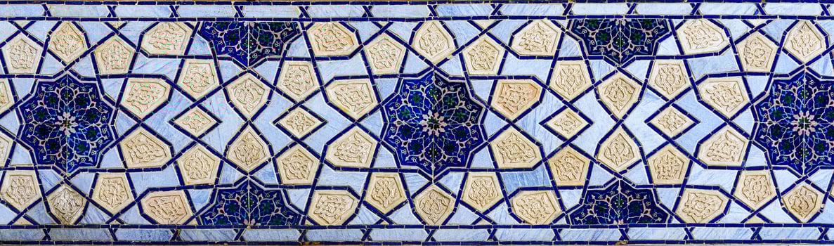 Geometric traditional Islamic ornament. Fragment of a ceramic mosaic. photo