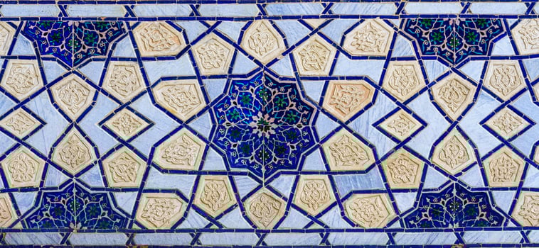 Geometric traditional Islamic ornament. Fragment of a ceramic mosaic. photo