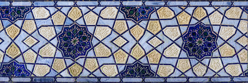 Geometric traditional Islamic ornament. Fragment of a ceramic mosaic. photo