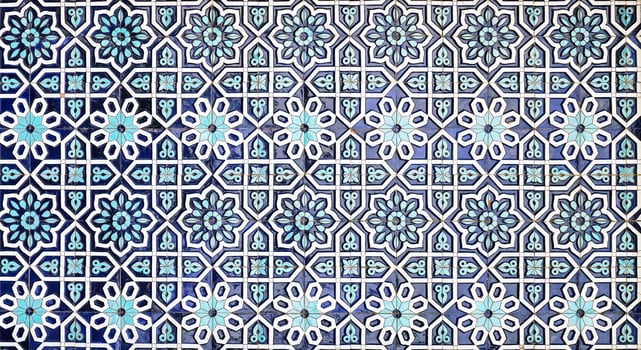 Geometric traditional Islamic ornament. Fragment of a ceramic mosaic. Abstract background. photo