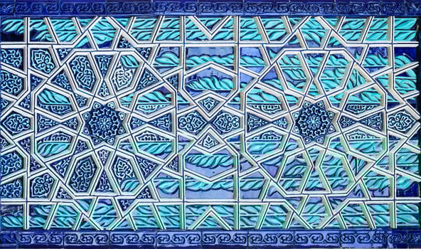 Geometric traditional Islamic ornament. Fragment of a ceramic mosaic. Abstract background. photo