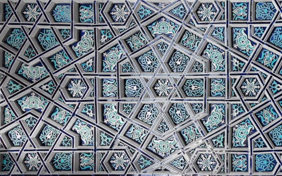 Geometric traditional Islamic ornament. Fragment of a ceramic mosaic. Abstract background. photo