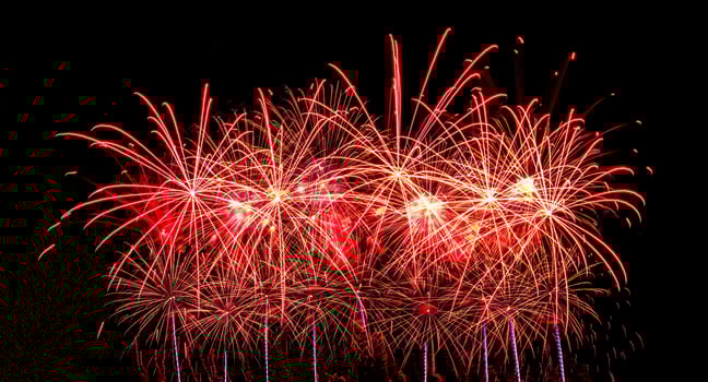 Colorful celebration fireworks isolated on a black sky background. photo