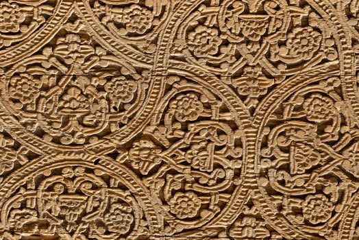 Fragment of an ancient carved wooden door. Ornate. photo