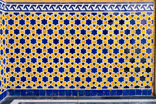 Geometric traditional Islamic ornament. Fragment of a ceramic mosaic. photo