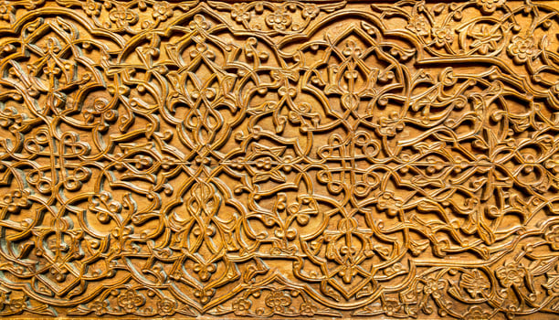Fragment of an ancient carved wooden door. Ornate. photo