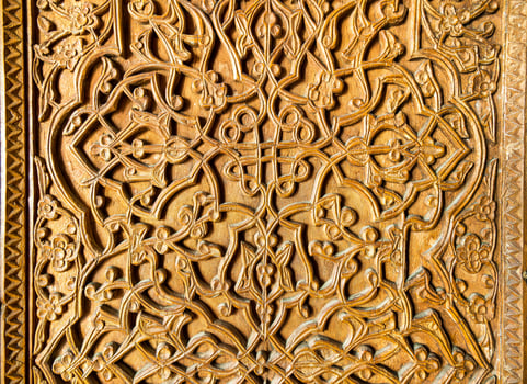 Fragment of an ancient carved wooden door. Ornate. photo