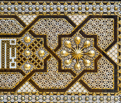 Antique oriental metal ornament on the chest. Abstract background. photo