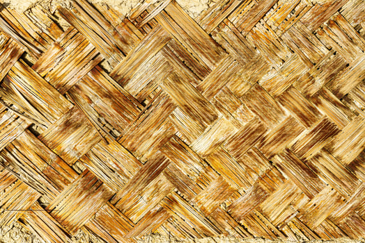 The texture of the frame of an oriental building made of woven bamboo. Abstract background. photo