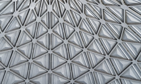 The steel inner part of the roof with the framework of the Chorsu Bazaar in Tashkent. Geometric architectural background. photo