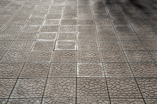 The texture of a tiled pavement with perspective. photo