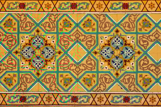 Geometric traditional Islamic ornament on a tile. Fragment of a ceramic mosaic. photo