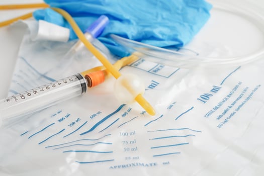 Foley catheter and urine drainage bag collect urine for disability or patient in hospital. photo