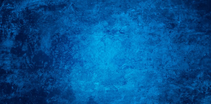 Dynamic Navy Blue Stucco Texture with Spotlight, Abstract Grunge Accent Piece on Wide Angle Background. photo