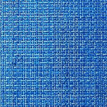 A blue and white woven fabric with a blue background photo