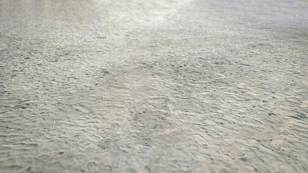 Foot print on river bed sand photo