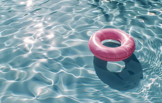 Pink Ring Floating in Water photo