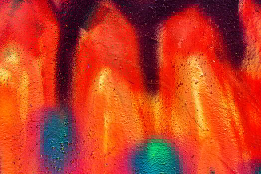 Colorful graffiti painted on a wall. Abstract urban background. Spray painting art. photo