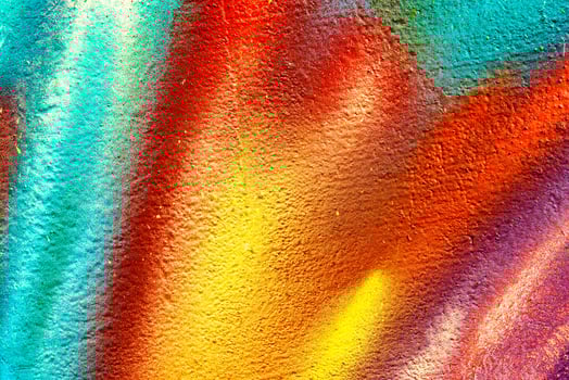 Colorful graffiti painted on a wall. Abstract urban background. Spray painting art. photo