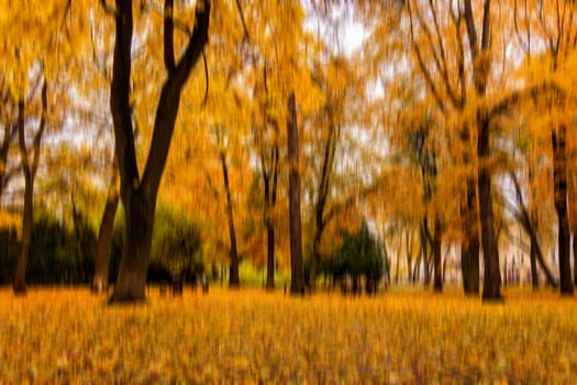 Autumn park vertical motion blurr background. Fall season abstract. photo