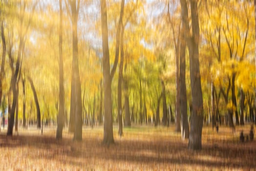 Autumn park with sunshine and vertical motion blurr background. Fall season abstract. photo