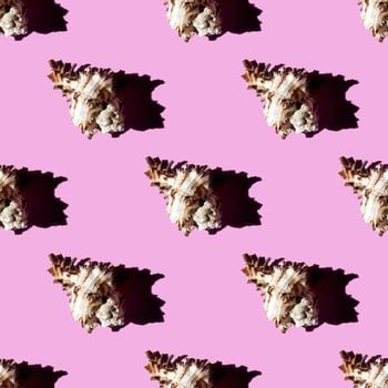 Seamless pattern of clam shells on a pastel background. photo
