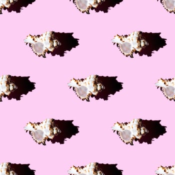 Seamless pattern of clam shells on a pastel pink background. photo
