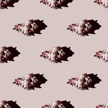 Seamless pattern of clam shells on a pastel yellow background. photo