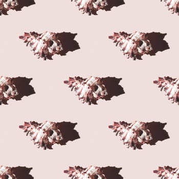Seamless pattern of clam shells on a pastel yellow background. photo