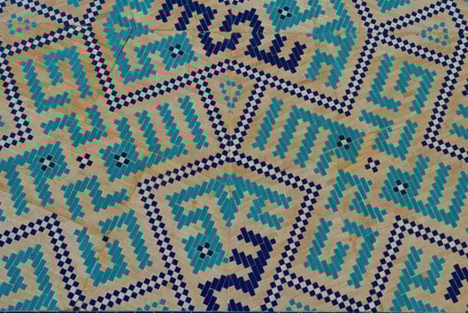 Geometric traditional Islamic ornament. Fragment of a ceramic mosaic. photo