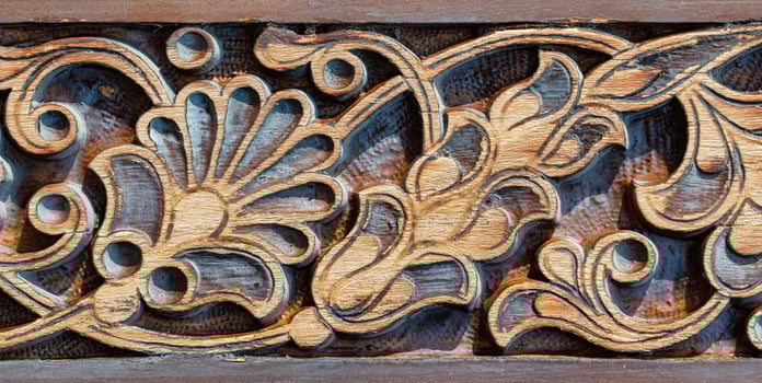 Fragment of an ancient carved wooden door. Ornate. photo