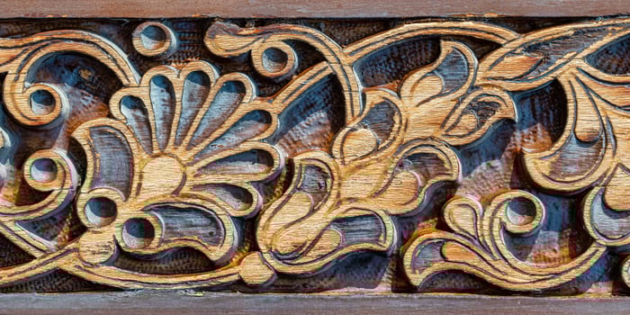 Fragment of an ancient carved wooden door. Ornate. photo