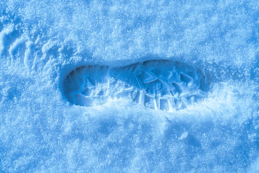 Boot track on a snow in winter. photo