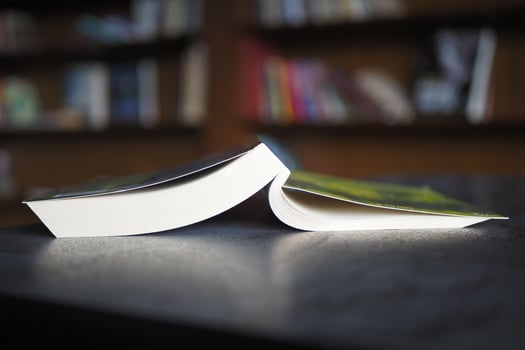 stack of books on wooden table photo