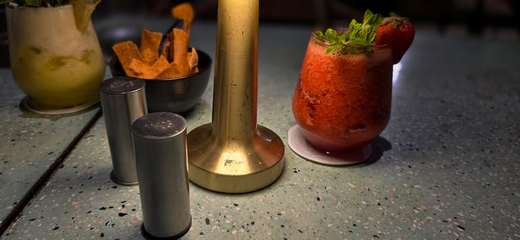 Fruit cocktail smoothie diet detox, tropical fruit summer cocktail with garnish, and ice on restaurant background photo