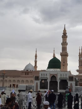 Madinah, Saudi Arabia, 29 March 2024 - Beautiful daytime outdoor view of Prophet's Mosque Madinah in dark clouds and rain. photo