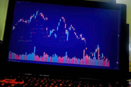 laptop displaying stock chart growth photo