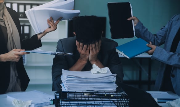 Stressful business man have so many paperwork in the office photo