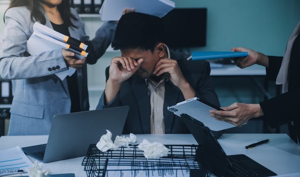 Stressful business man have so many paperwork in the office photo