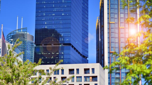 Eco building in modern city concept. Modern office building with the fresh green leaves. photo