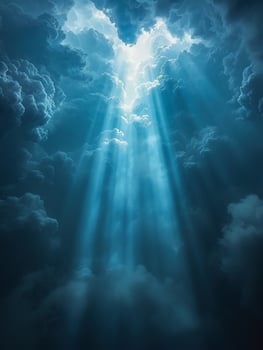 Sunbeams through heavy rain clouds photo