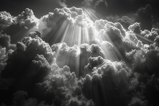 Sunbeams through heavy rain clouds photo