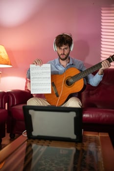 Boy Teaching Remote Music Guitar Lesson By Computer Call photo