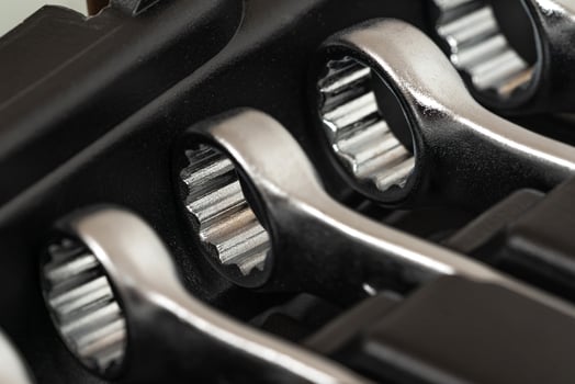 Ring wrenches in a row in a box for hand tools. photo