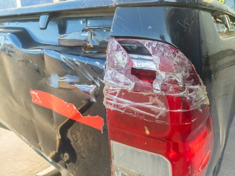 The rear stop light and turn signal of the car were broken due to the collision photo