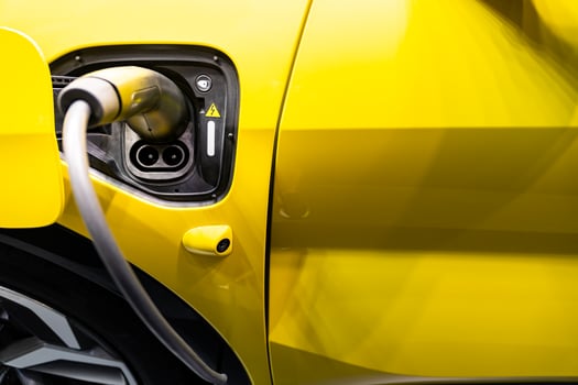 EV Car or Electric car at charging station with the power cable supply plugged. EV charging station for electric car in concept of green energy and eco power produced. photo