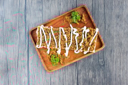 Front view Toast with shredded beef topped with mayonnaise. photo