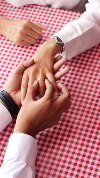 Happy moments when a man proposes to his girlfriend by giving a ring at a cafe. photo
