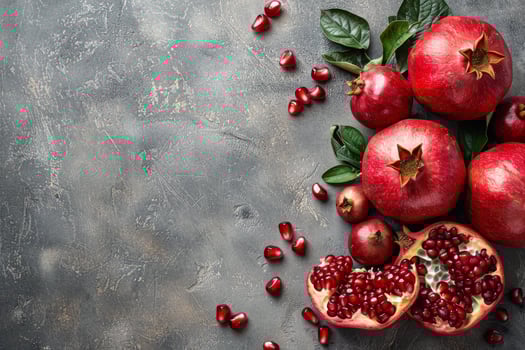 Group of Red Pomegranates With Green Leaves photo