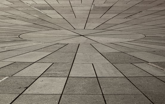 Texture of gray tsetse sidewalk in sunlight in Tallinn. Gray rectangular tiles in perspective. Background. Horizontal. photo